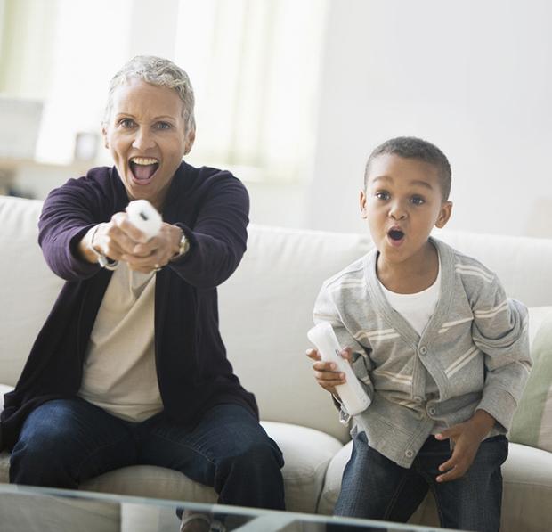 Grandmother and grandson playing video game