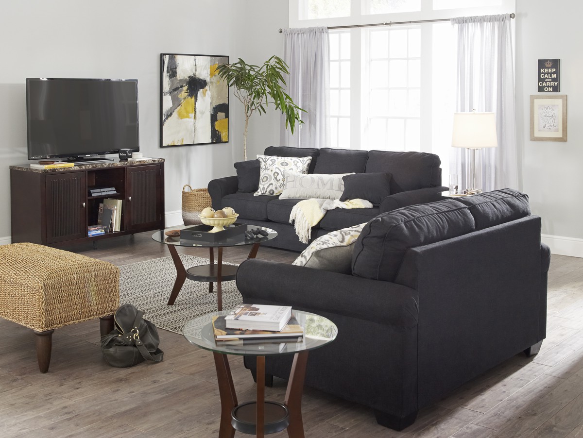 Black loveseat and sofa set in modern living room 