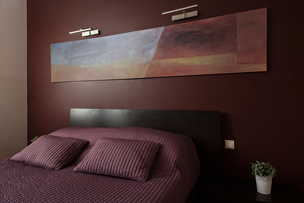 Luxury bedroom with burgundy paint
