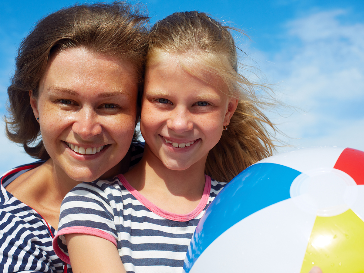 Mom and daughter with beach ball