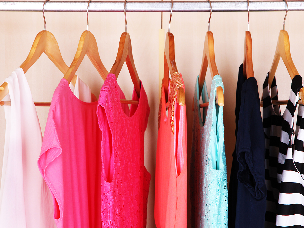Dresses hanging in an organized closet.