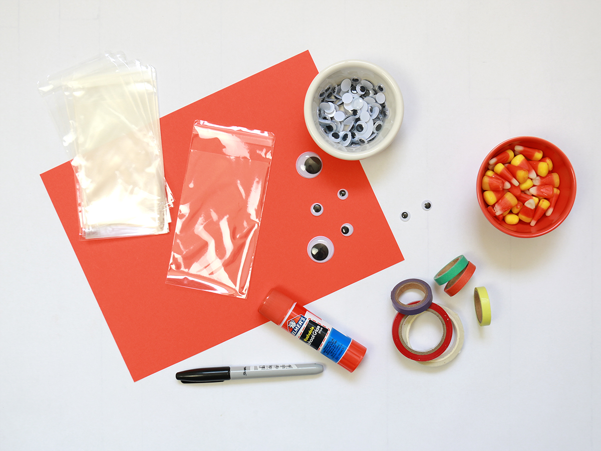 Materials needed to make monster Halloween treat bags