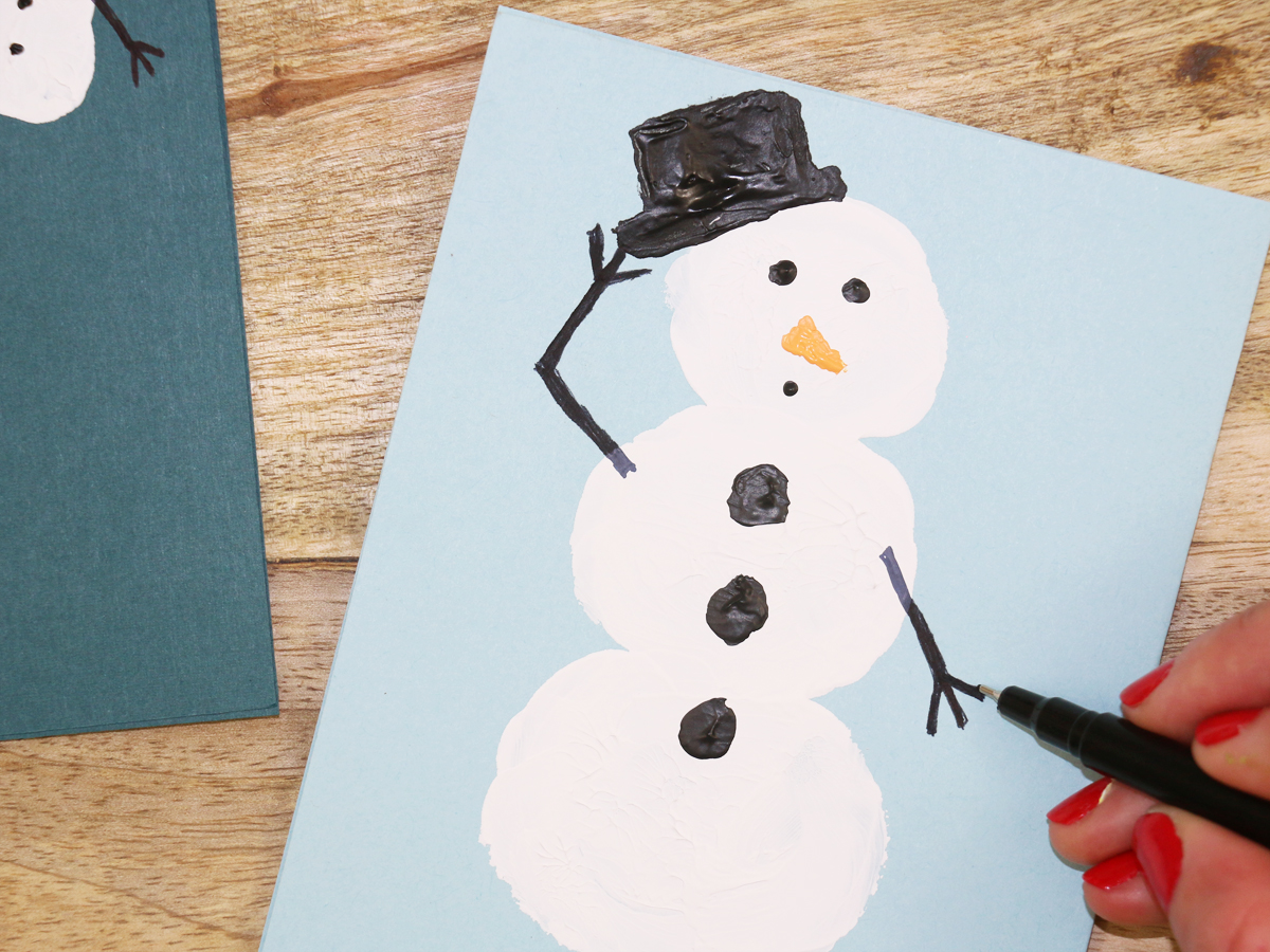 Step 2 in making snowman holiday cards