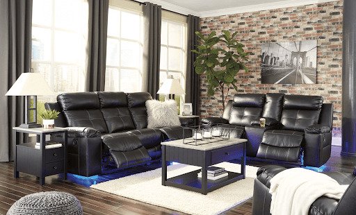 black recliner and loveseat with LED lights in bright living room 