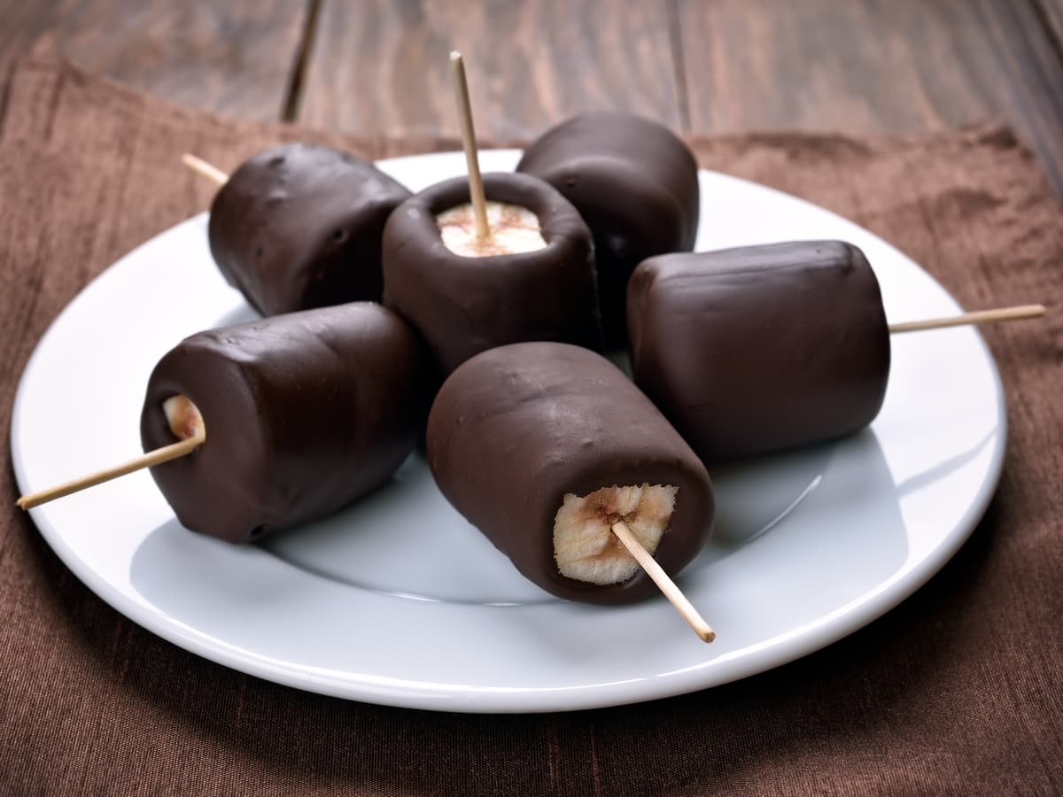 Chocolate covered bananas on a plate