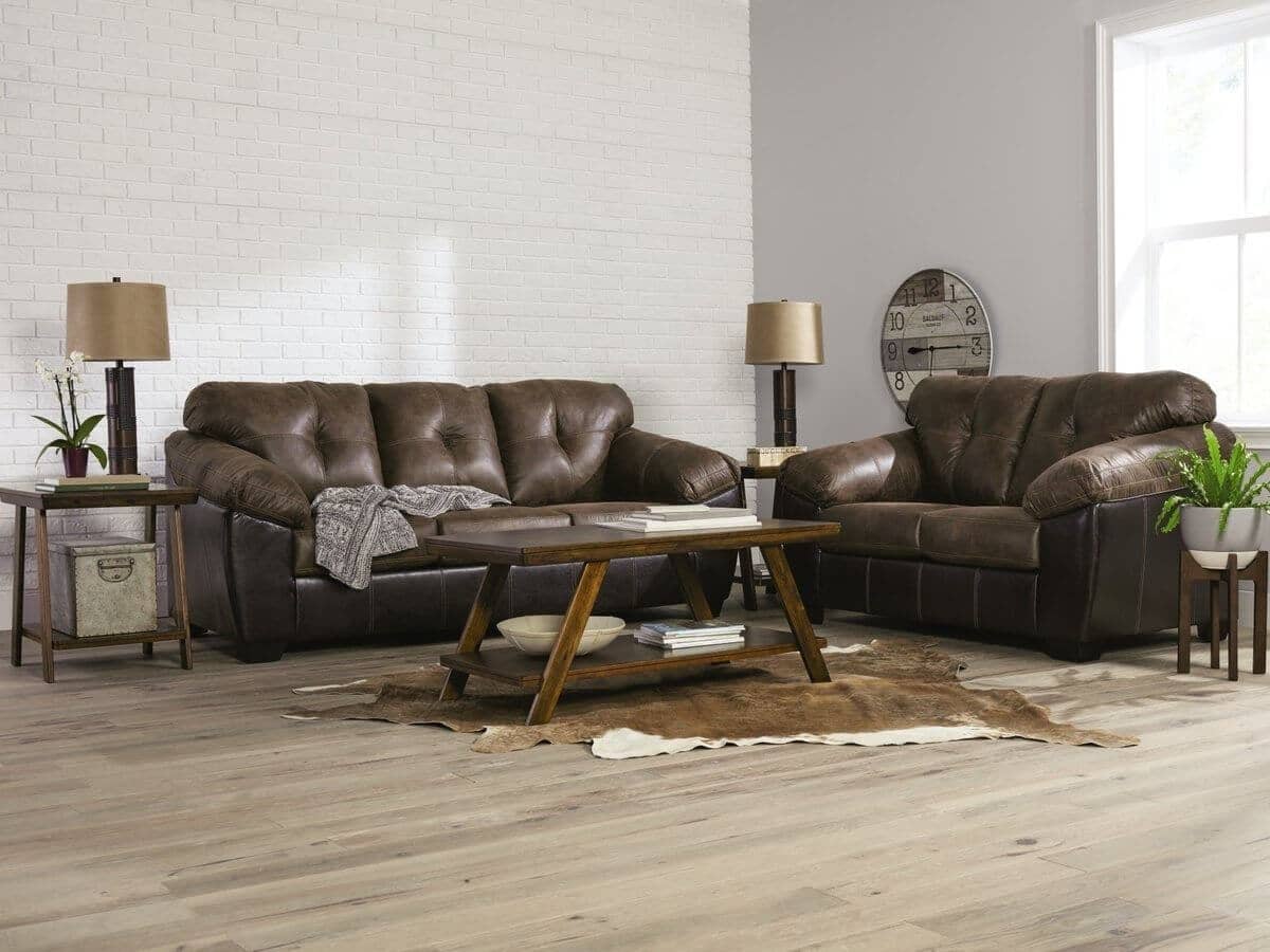 Brown leather couch and loveseat