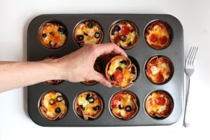 Mini pizzas in a muffin pan