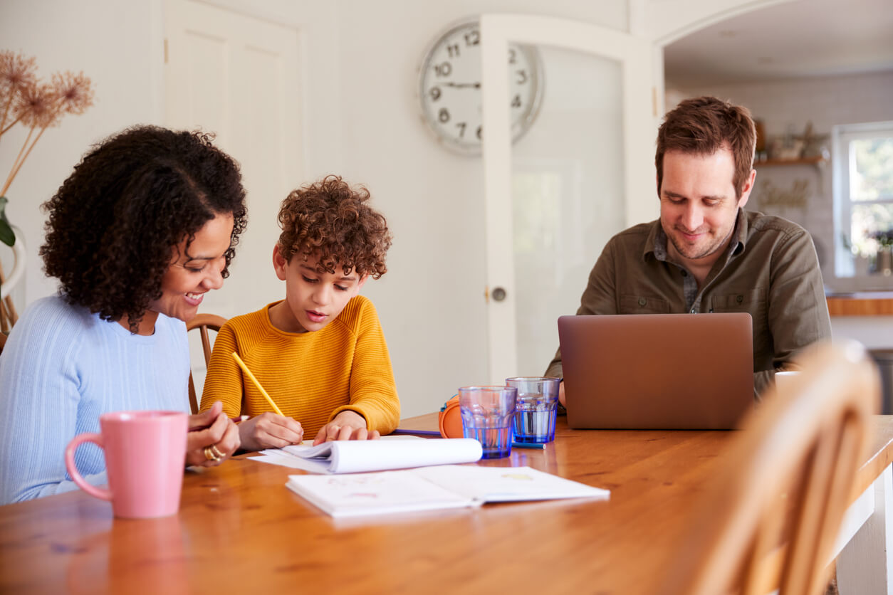 family working from home and homeschooling