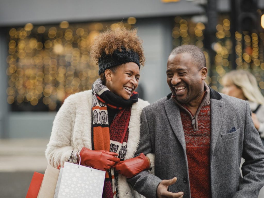 Couple dressed for winter smiling at each other