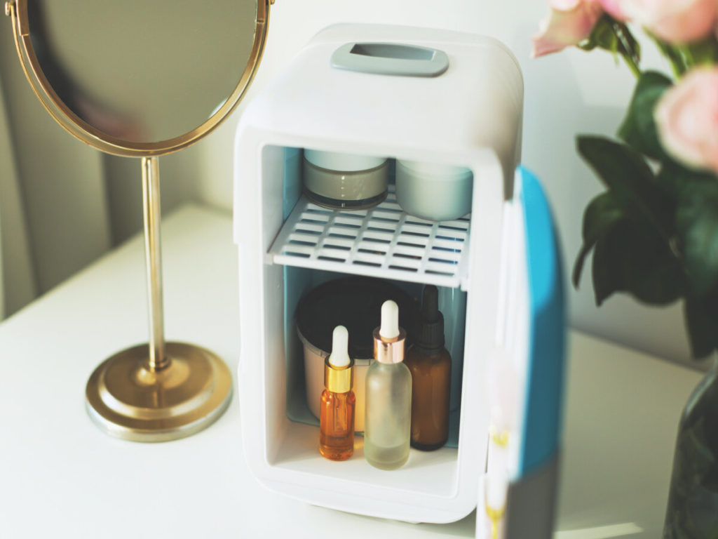 Stylish skin care mini fridge on vanity table