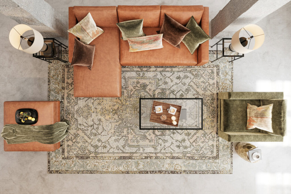 Top view of living room with eclectic rug and burnt orange/green color theme