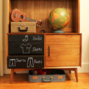 <b>Draw-On Drawers</b><br> Another creative bedroom idea and use for chalkboard paint: draw-on drawers. Transform a dresser by painting the front with the chalkboard paint (or you can use chalkboard contact paper, like we did here, for the same effect). Kids will get a kick out of identifying what’s in each drawer with words and symbols, and they may even get dressed for school faster. Dresser with labeled drawers and a ukulele and globe on top