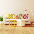 <b>A Neutral Palette</b><br>
Walls and furniture in grays, khaki, shades of white and cream allow the natural textures in the room and the lines of the furnishings to stand out. Use accent pieces like pillows, throws, rugs, and artwork to add pops of color. White couch with geometric pillows