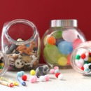 <b>Toy Displays</b><br> A favorite collection of cars, dinosaurs, tiny dolls, or building blocks becomes an instant room accessory when stashed in clear glass or plastic jars. Plus, this tactic makes for quick and easy clean-up. Various jars filled with craft supplies