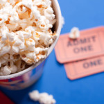 <strong>4. Movie Night.</strong> A bucket of microwavable popcorn makes a cute “gift basket” when topped with a gift card to a local movie theater and a couple of boxes of candy.