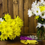 <strong><strong>8. <a href="https://blog.rentacenter.com/a-bouquet-of-spring-flowers-you-can-make-yourself/" target="_blank">DIY Flowers</a>.</strong> </strong>Everyone loves flowers, and inexpensive grocery store flowers take on a sophisticated look when they’re presented in a pretty vase or a mason jar. Use a mesh or burlap bow for a finishing touch.