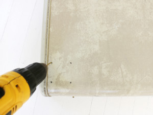 Drill into the holes.