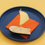 Once the zucchini boat is filled with hummus, it's ready for the sail.