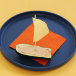 Once the zucchini boat is filled with hummus, it's ready for the sail.