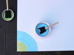 Start painting your design on the canvas.