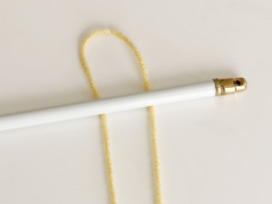 Fold each piece of yarn in half.