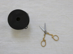 Cut a strand of monofilament to your desired length for hanging the garland; we recommend 6 to 8 feet.