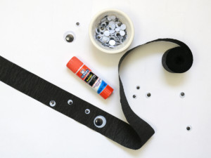 Use a glue stick to secure a handful of googly eyes to each streamer.