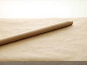 Before guests arrive, cover the top of the buffet table with packing or construction paper.