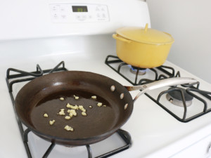 Heat olive oil in a small skillet over medium heat; cook and stir garlic until softened, about 2 minutes.