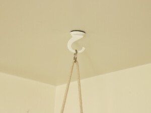Hang planter from a ceiling hook.
