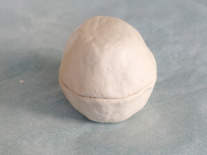 Join the two spheres together.