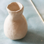 Use your fingers to shape the lip of the vase. If needed, very lightly wet your fingers to help you achieve any intricate details at the top.