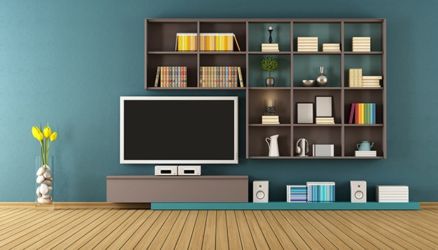 <b>Use Vertical Surfaces Wisely</b><br> Make the most of your home’s walls with floor-to-ceiling <a href="https://blog.rentacenter.com/get-the-look-spruce-up-your-home-with-color?WT.z_position=blog" target="_blank">bookshelves</a>, floating shelves in corners, a discreet closet between wall studs, towel rods and coat hooks on the backs of bathroom or bedroom doors, and plastic containers on the insides of pantry doors and kitchen cabinets.