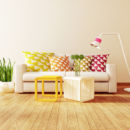<b>A Neutral Palette</b><br>Walls and furniture in grays, khaki, shades of white and cream allow the natural textures in the room and the lines of the furnishings to stand out. Use accent pieces like pillows, throws, rugs, and artwork to add pops of color. White couch with geometric pillows